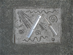 Sidewalk advertisement for haircuts on Eastlake Avenue between Roanoke and Edgar.