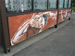 Bus stop under the I-5 overpass at the corner of Eastlake and Harvard.